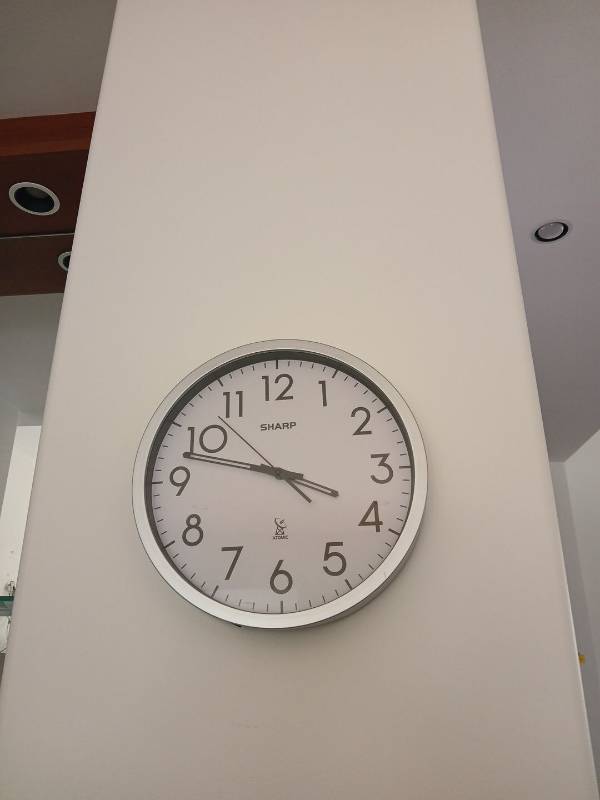 lot 1521 image: SHARP Atomic Analog Wall Clock 14 in, works, broken on bottom