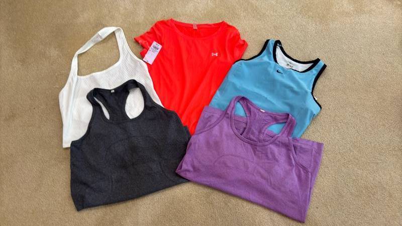 lot 1731 image: Womens Athletic Tops Under Armour and Nike Logo Pieces M L