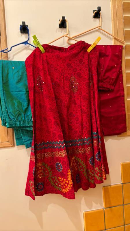 lot 1786 image: Two pair of pants and a skirt