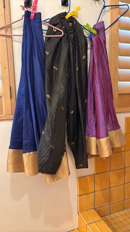 lot 1801 image: Lot of 3 Womens Skirts and Pants with Gold Trim in Blue, Black and Purple