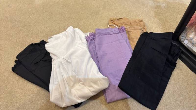 lot 1817 image: Four skirts and a pair of white pants
