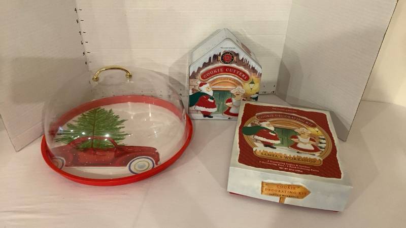 lot 2016 image: Williams-Sonoma Santas Workshop Cookie Cutters 12 Ct Tin and Decorating Kit with cookie displayed holder