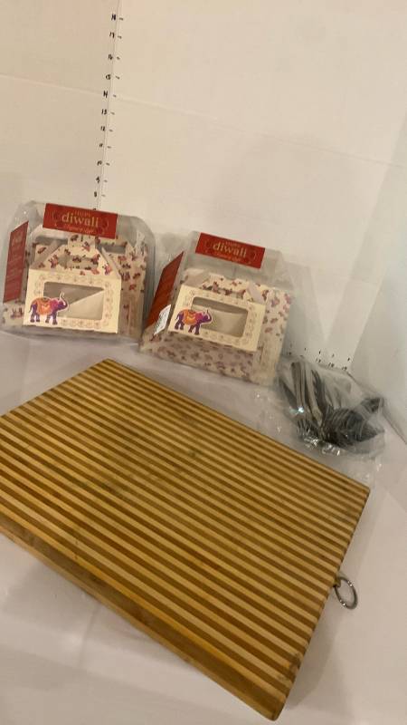 lot 2033 image: Lot of 2 Happy Diwali Window Gable Box Sets, Striped Cutting Board, Bag of Forks