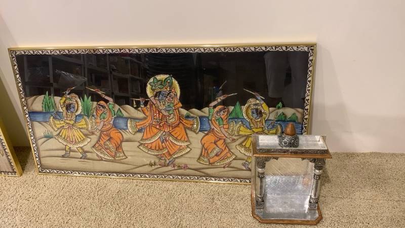 lot 2075 image: Framed wall decor 47x23 and Indian home prayer altar, known as a Pooja Mandir.