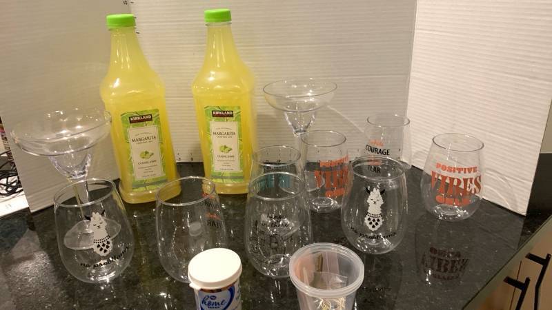 lot 2093 image: Margarita mix and assorted plastic drinking glasses