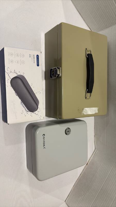 lot 2106 image: Lock boxes and wireless speaker