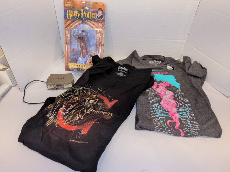 lot 2225 image: Harry Potter Lot Quidditch Harry Figure, 2 Size M T-Shirts, Monster Book USB Hub