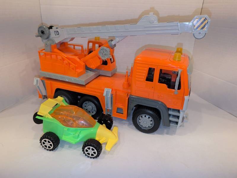 lot 2226 image: Toy Fire Truck with Extending Ladder Arm and Small Race Car