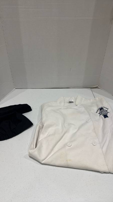lot 2380 image: Le Cordon Bleu White Double-Breasted Chef Coat with Black Chef Hats