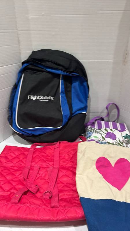 lot 2384 image: FlightSafety International Backpack and Tote Bags Lot, 4 Pieces