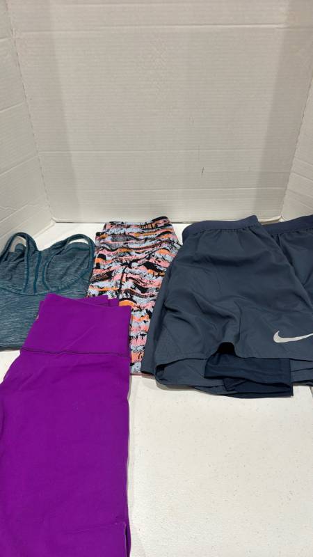 lot 2388 image: Lulu lemon and other athletic pants, Nike shorts and tank top size M