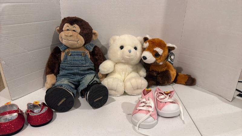 lot 2459 image: Stuffed animals with extra shoes