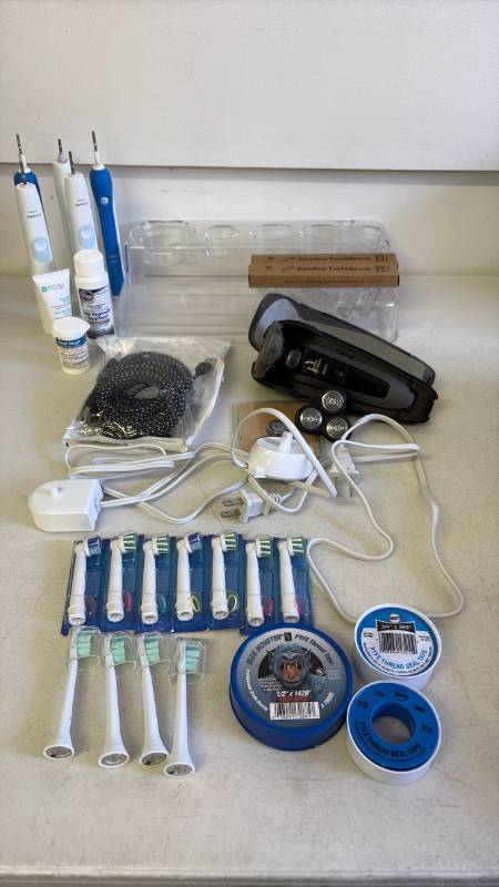 lot 3038 image: Sonicare toothbrushes, razor and more. All untested.
