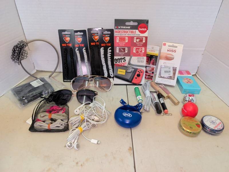lot 3100 image: Assorted Lot Sof Sole No Tie Laces, Xtreme Switch Protector, KISS Nails, Sunglasses