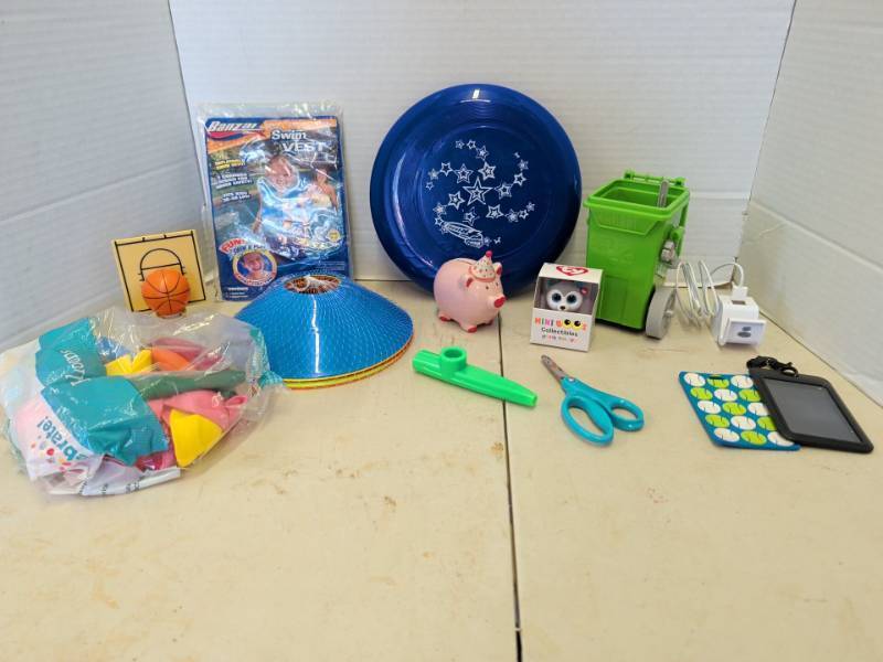 lot 3101 image: Assorted Kids Toy Lot Banzai Swim Vest, Wham-O Frisbee, Ty Mini Boos, Kazoo