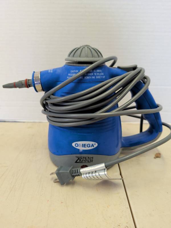 lot 3119 image: OMEGA Mini Steam Zapper Handheld Steamer
