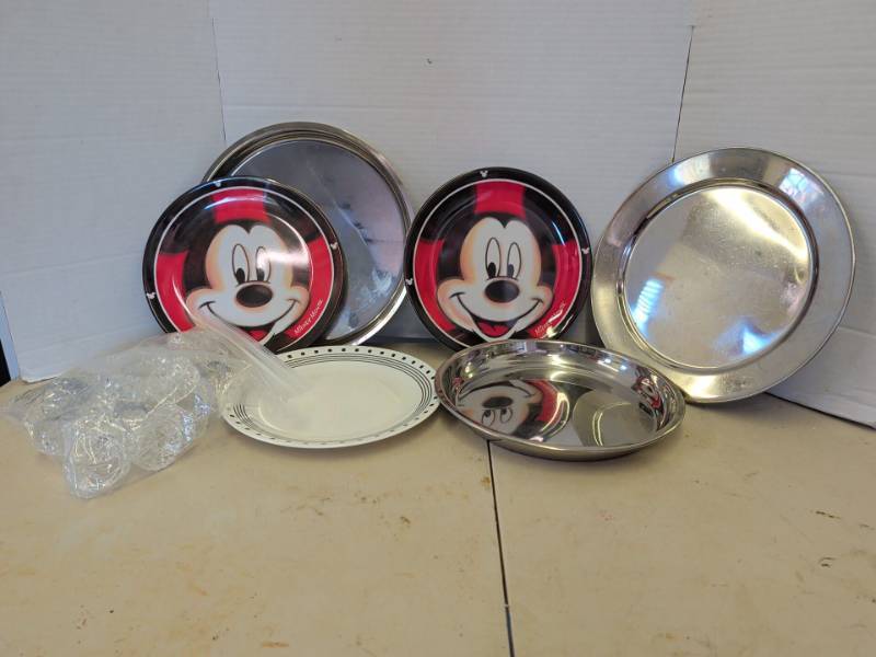 lot 3301 image: Plastic Mickey Mouse Plates, plastic napkin rings, metal chargers or serving trays