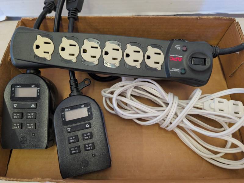 lot 3329 image: APC 6 Outlet Surge Protector Strip, 2 myTS Plug-In Timers, Extension Cord Lot