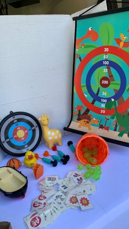 lot 3411 image: Dinosaur Roll-Up Dart Target Game with Darts and Assorted Toys Lot