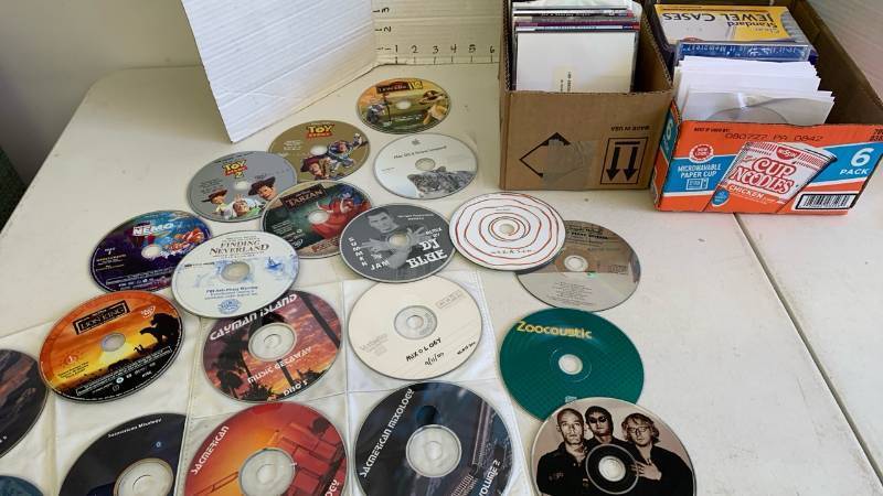 lot 3454 image: Blank CDs and assorted DVDs with no cases