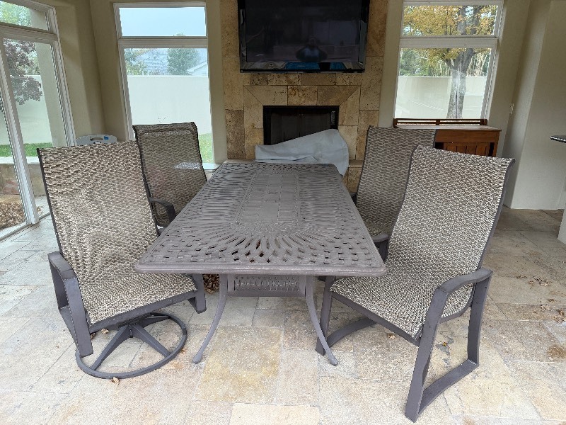 lot 36 image: Outdoor Rectangular Dining Table 29 x 42 x 42 inches with 2 rocker chairs and 2 stationary chairs
