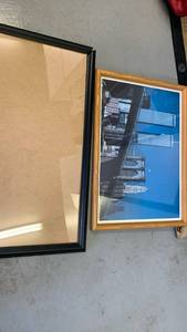 lot 3804 image: Lot of 2 Picture Frames, Black Frame and Wood-Tone Frame with Twin Towers City Skyline Print 20x15 black frame needs glued
