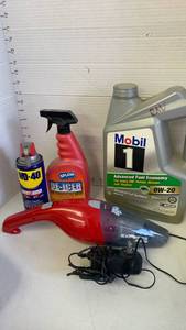 lot 3811 image: Car vac, de icer, WD40 and Mobil 1 oil. Only about 2 inches full