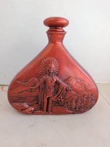 lot 4204 image: Red-Orange Decorative Bottle with Stopper, Relief Figure and Mountain Scene 10in tall,