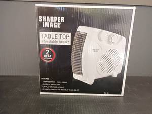 lot 4333 image: New in Box.   Sharper Image Table Top Heater