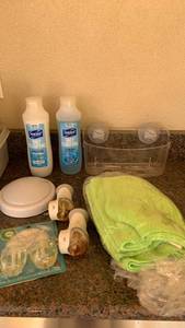 lot 5008 image: Suave shampoo, air fresheners with refills, shower, caddy, and microfiber cloths