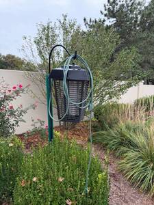 lot 6005 image: Bug zapper with shepherds hook approximately 48 in tall