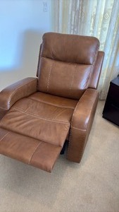 lot 18 image: Brown leather rockerrecliner with cream stitching with USB