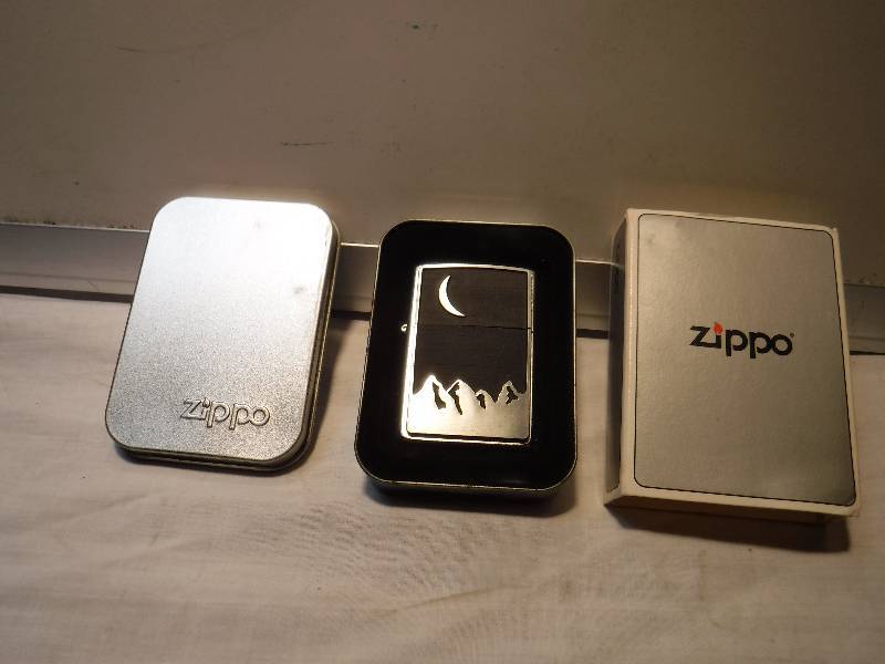 lot 1033 image: Zippo wind proof lighter with moon and mountains scene