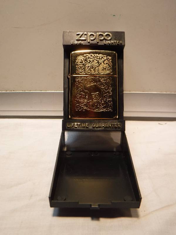 lot 1036 image: Gold tone Camel collectible Zippo lighter FANCY