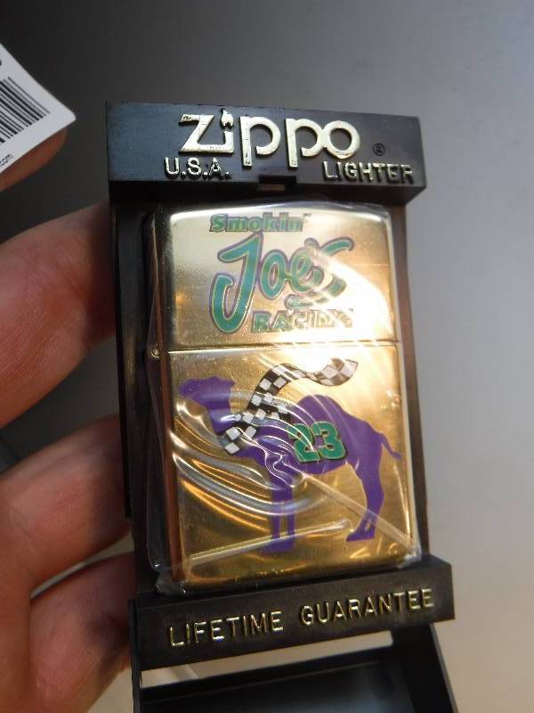 lot 1040 image: Gold tone Smoken Joes racing Zippo Lighter with purple camel