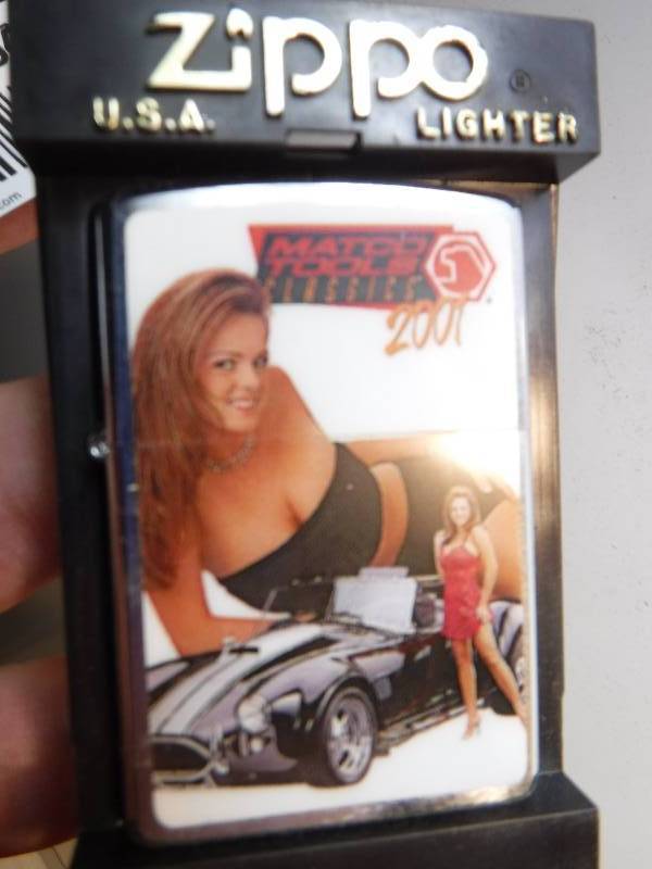 lot 1041 image: Mac tools classic Zippo lighter with pin up and classic car