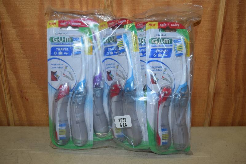 lot 420 image: 12 Gum Travel Toothbrushes