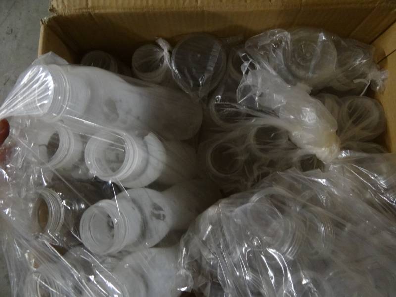 lot 9339 image: Box of Plastic Liquid Dispensers, Box of Ketchup and Mustard Dispensers, Clear Plastic Canister Stand, Black Plastic Canister Stand, Bag of Display Fruit