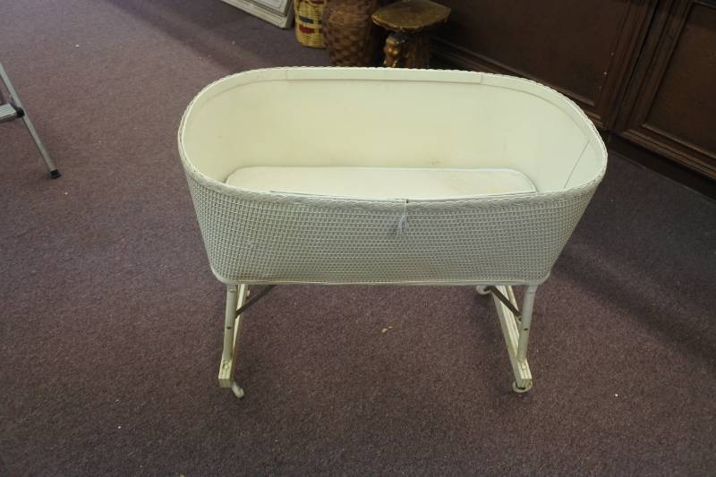 lot 3065 image: Vintage Wicker Baby Bassinet with Fold Up Roller Legs