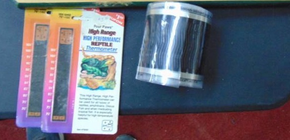 lot 7347 image: Reptile heat strip - fake rocks - thermometers