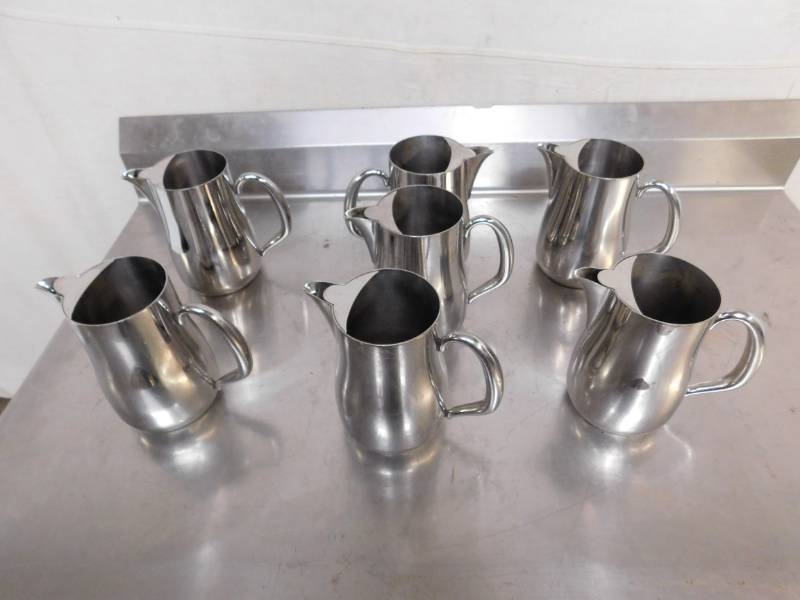 lot 2593C image: 7 Walco Stainless Steel Beverage Pitchers with Lids