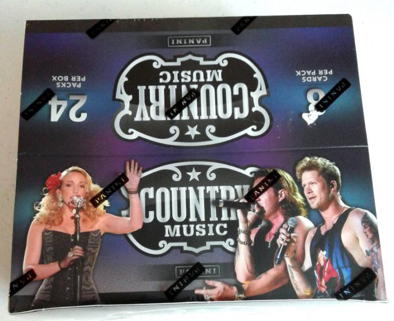 lot 1032 image: Factory Sealed Box 2013 Panini Country Music with 24 Packs - 8 Cards per Pack - Two Autographs or Relics In the Box