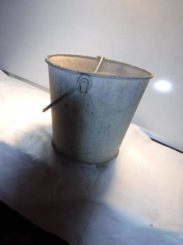lot 7377 image: Metal bucket with fishing net