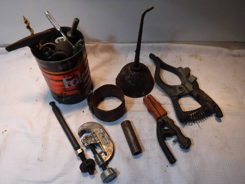 lot 7522 image: Coffee tin full of garage goodies including an oil can and vice grip