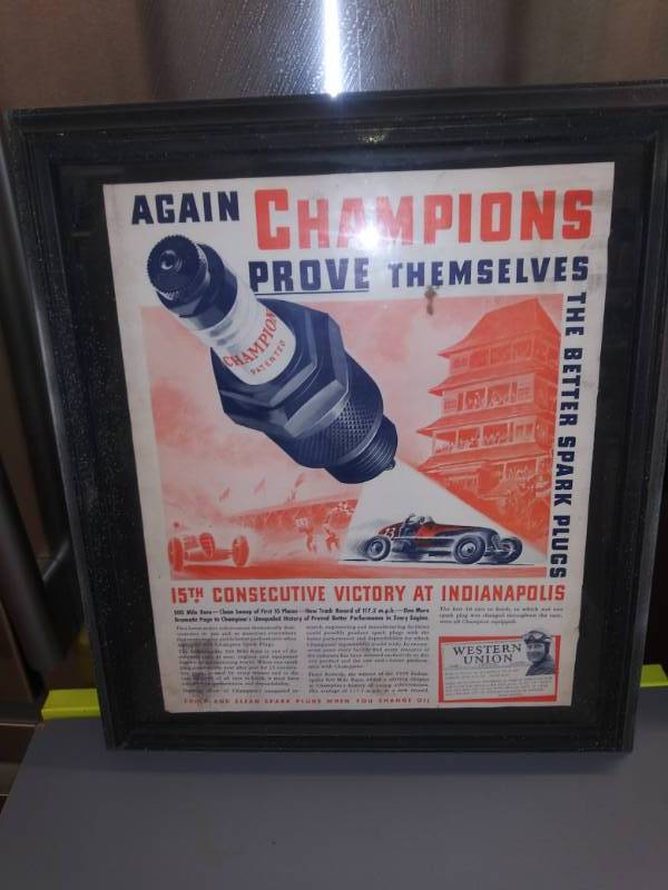 lot 3145 image: Original 1938 - Champion Spark Plugs - Floyd Roberts Indianapolis 500 Winner Ad in Frame