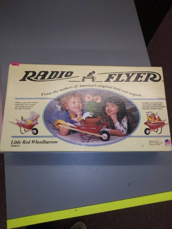 lot 3149 image: Radio Flyer Little Red Mini Wheelbarrow Planter Decor