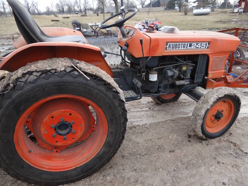 lot 2 image: Kubota L245 Tractor With Rotary Cutter Attachment