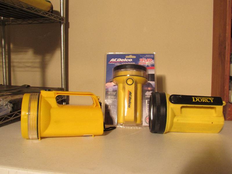 lot 5005 image: 3 6V Flashlights - 1 AC Delco, 1 Dorcy, 1 no name