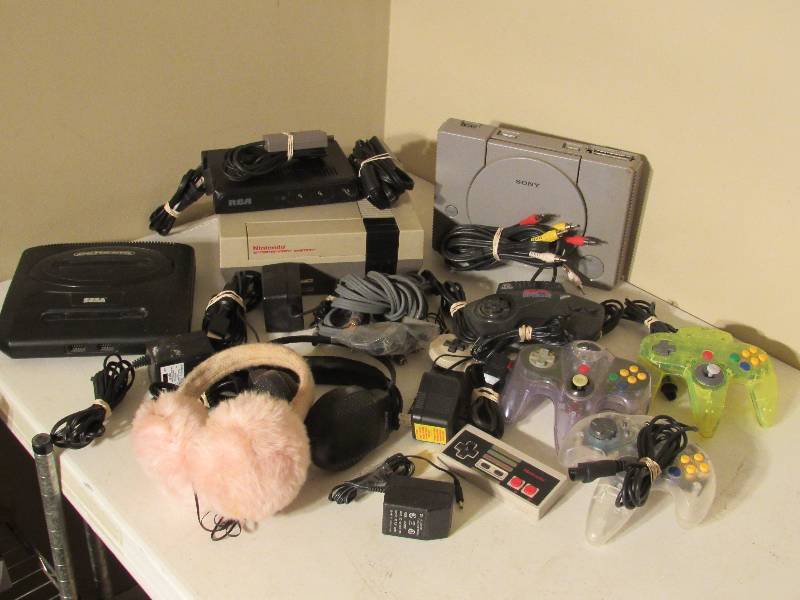 lot 5186 image: Nintendo, Sega Genesis, and Playstation with assorted controllers