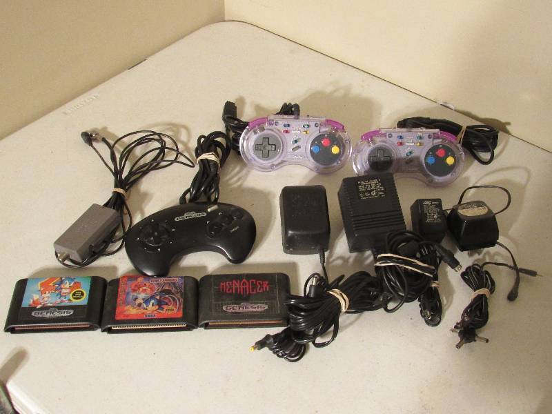 lot 5187 image: Sega genesis games and controllers